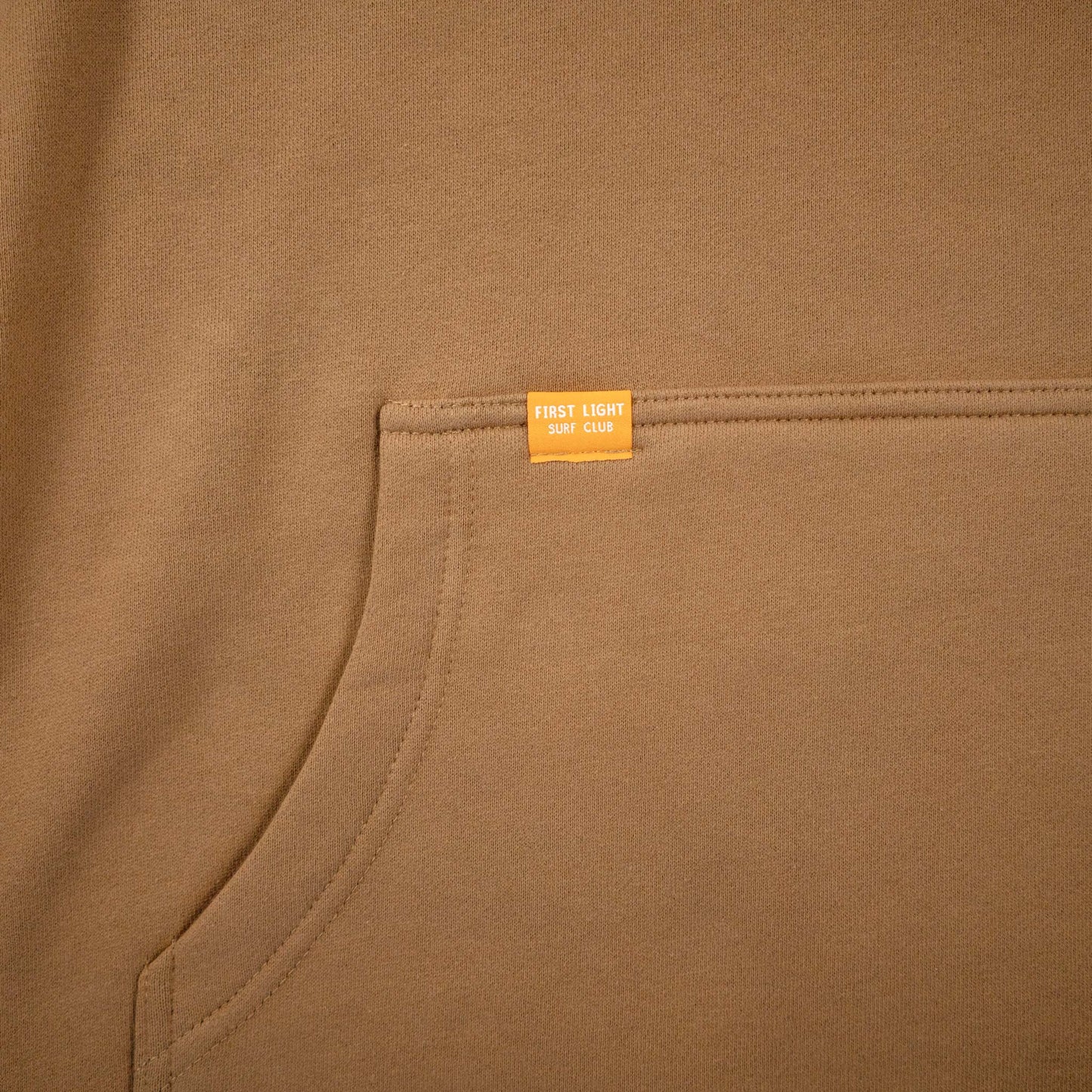 First Light Surf Club Dawn Patrol Hoodie Fleece Camel, Woven Label Pocket Detail